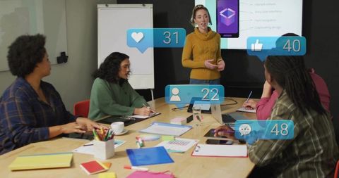 Female-led team presenting mobile app mockup with live social engagement overlays