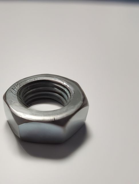 Close-up of Industrial Metal Nut on White Background - Download Free Stock Images Pikwizard.com