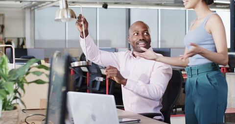 Engaged Coworkers Discussing Ideas in Modern Office