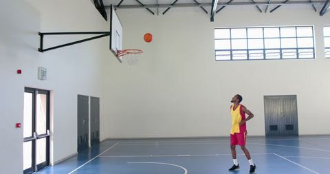Basketball Player Focus Shooting Hoops in Indoor Court - Download Free Stock Images Pikwizard.com