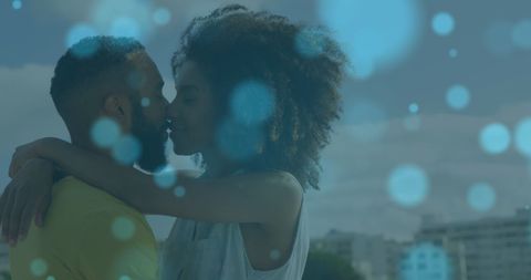 Romantic African American Couple Embracing on Beach with Artistic Light Overlay
