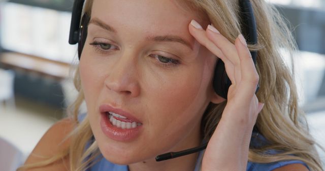 Stressed Customer Service Representative Wearing Headset at Work - Download Free Stock Images Pikwizard.com