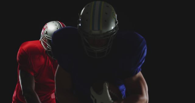 American Football Players Preparing For Play in Dark Studio - Download Free Stock Images Pikwizard.com