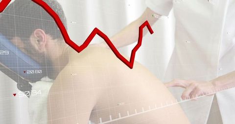 Male client receiving therapeutic back massage with analytics overlay indicating recovery