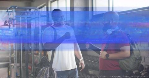 Gym buddies fist bumping after workout near dumbbell rack with blue glitch overlay