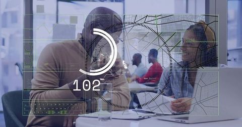 Colleagues Collaborating with Futuristic HUD Overlay in Modern Coworking Workspace