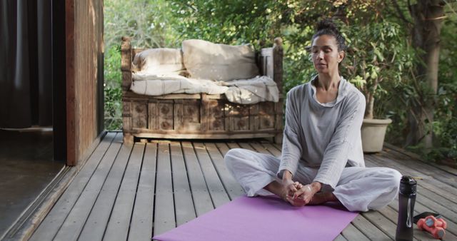 Woman Practicing Meditation on Patio with Mature Trees and Wooden Deck - Download Free Stock Images Pikwizard.com