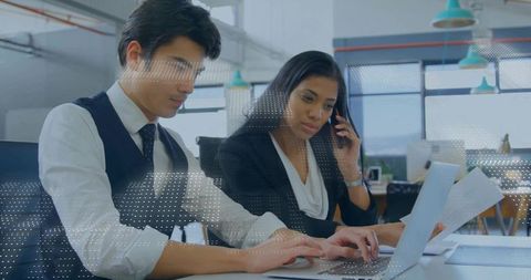 Professional colleagues collaborating in modern office environment