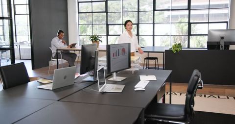 Professional workspace with colleagues collaborating on projects