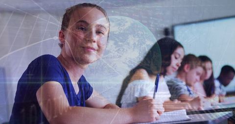 Smiling student among diverse class with graph and globe overlay