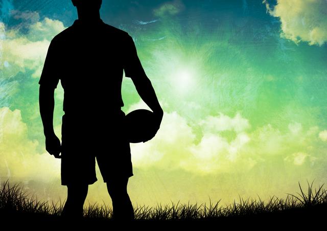 Powerful silhouette of a rugby player clutching the ball, set against a beautiful, transitioning sunset sky. Captures the essence of rugby, outdoor sportsmanship, and scenic fields. Ideal for use in sports promotions, motivational posters, and outdoor activity ads.