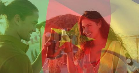 Couple Toasting at Sunset in Tropical Beach Lounge