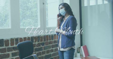 Professional Woman on Phone Promoting Heart Month Awareness