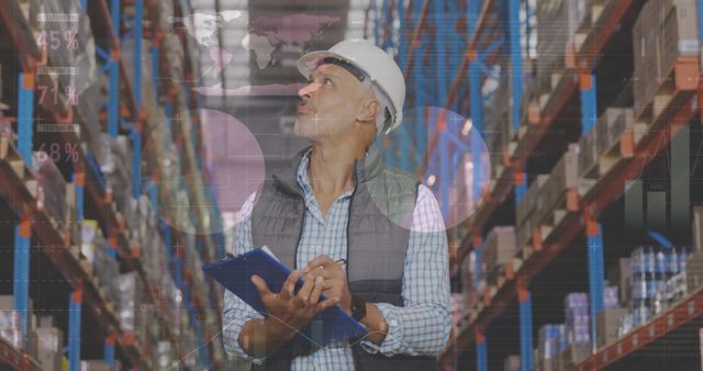 Warehouse manager inspecting inventory in warehouse aisle - Download Free Stock Images Pikwizard.com