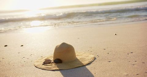 Straw Hat and Sunglasses on Sandy Beach Under Sunlight - Download Free Stock Images Pikwizard.com