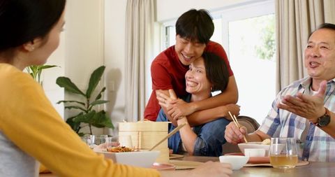 Family Gathering With Asian Cuisine and Joyful Atmosphere