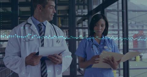 Medical team reviewing digital patient records in modern clinic with data overlay