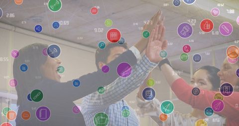 Diverse business team engaging with digital interface icons