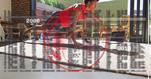 Holding plank with laptop digital overlay home fitness training core strength focus