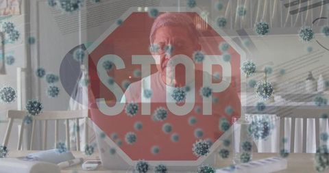 Senior man using laptop for health safety and virus awareness