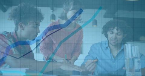 Collaborative team analyzing growth charts and brainstorming strategy in modern workspace