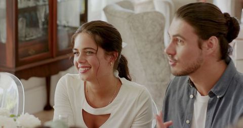 Couple Enjoying Festive Dining Experience in Elegant Setting