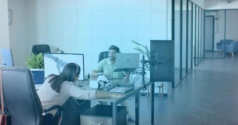 Colleagues Collaborating in Modern Tech Office with VR Equipment