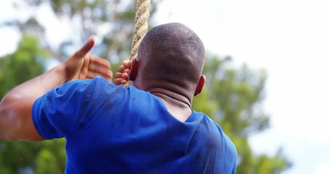 Young Boy Climbing Rope Outdoors with Determination - Download Free Stock Images Pikwizard.com