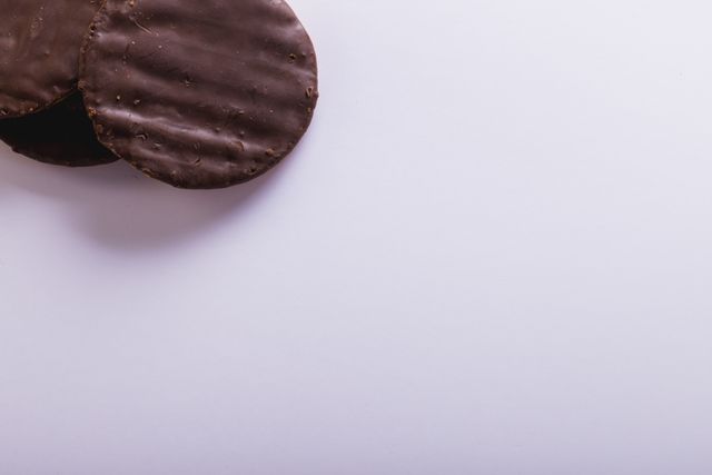 High angle close-up of chocolate cookies over white background, copy space - Download Free Stock Photos Pikwizard.com
