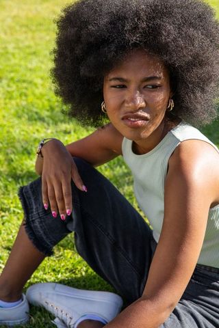 African american woman relaxing outdoors on sunny day