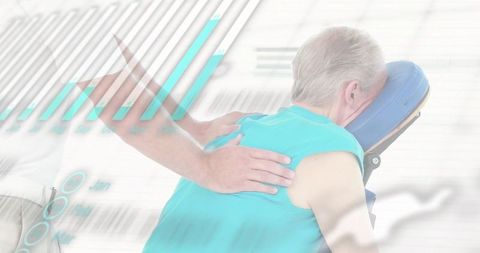 Older adult receiving seated massage on portable chair for physiotherapy, wellness and relaxation