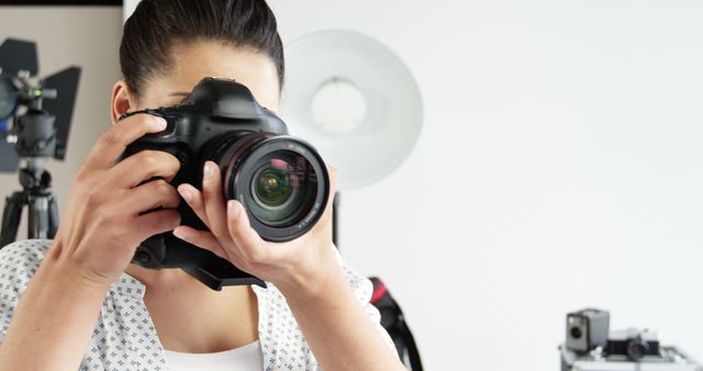 Professional Photographer with Camera in Studio Setting - Download Free Stock Images Pikwizard.com