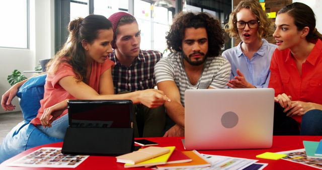 Diverse Team Collaborating on Project with Laptop in Modern Office - Download Free Stock Images Pikwizard.com