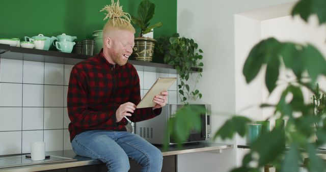 Happy Man with Tablet in Modern Minimalist Kitchen - Download Free Stock Images Pikwizard.com