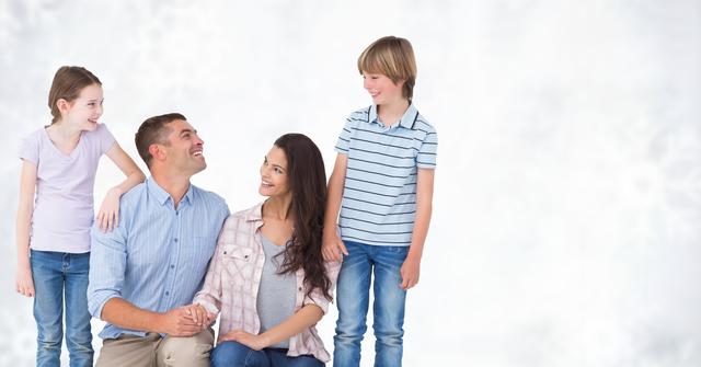 Digital composite of Happy family looking at each other against bright background