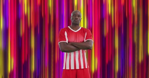 Athlete in Red and White Against Colorful Light Stripes