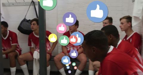 Teen soccer players relaxing with virtual approval in locker room