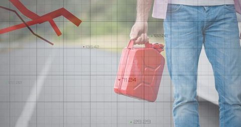 Man Carrying Fuel Canister Amid Financial Data Analysis - Download Free Stock Images Pikwizard.com