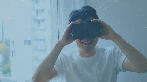 Smiling Man Using VR Headset Surrounded by Digital Network Connections