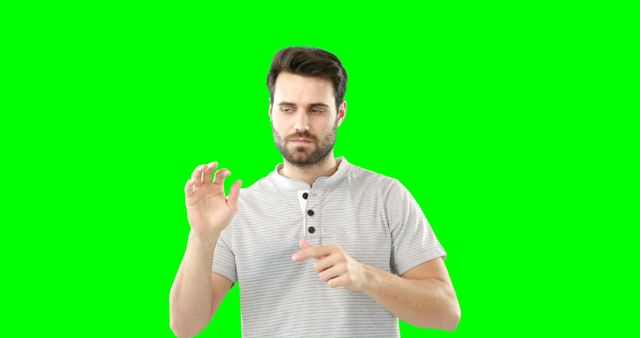 Man Using Virtual Interface with Green Screen Background - Download Free Stock Images Pikwizard.com