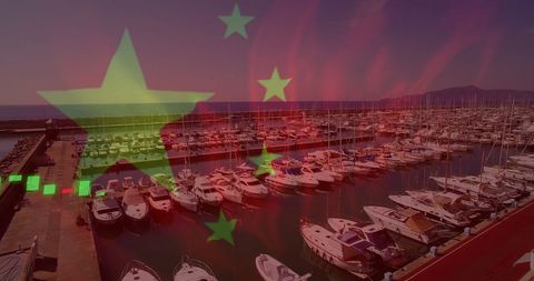 Boats Docking in Busy Marina with Vibrant Sky and Festive Lights