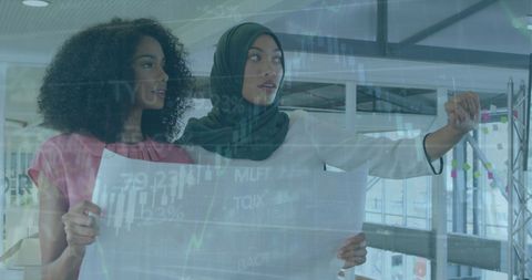 Diverse Businesswomen Analyzing Modern Financial Data