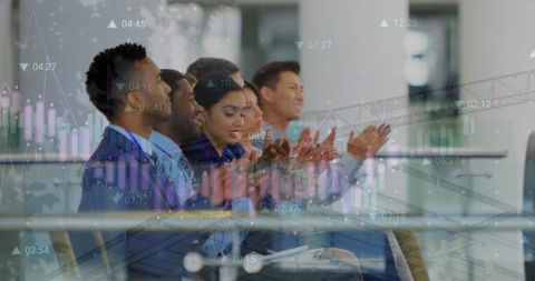 Diverse Business Team Celebrating Success with Data Analysis