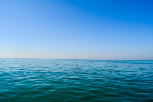 Calm Ocean with Clear Blue Sky Horizon - Download Free Stock Photos Pikwizard.com