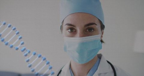 Female doctor wearing mask and surgical cap showing dna helix for genetics research