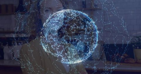 Woman interacting with holographic globe and connected network visualization in cafe