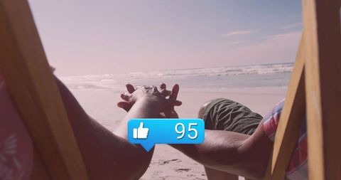 Couple Relaxing on Beach with Social Media Engagement Symbol