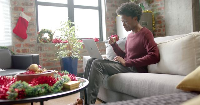 Young Woman Enjoying Christmas at Home While Working Remotely on Laptop - Download Free Stock Images Pikwizard.com