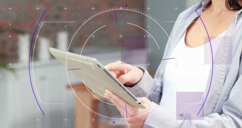 Confident Instructor Using Tablet in Sports Facility - Download Free Stock Images Pikwizard.com