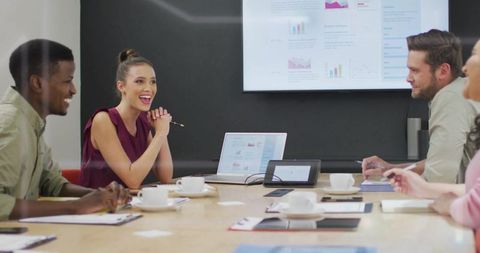 Diverse Team Collaborating in Modern Corporate Meeting Room
